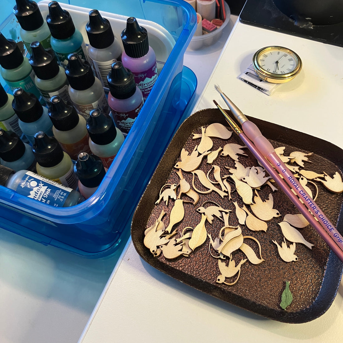 Tiny wood bird shapes are ready for me to apply colors before adding them to the clock.