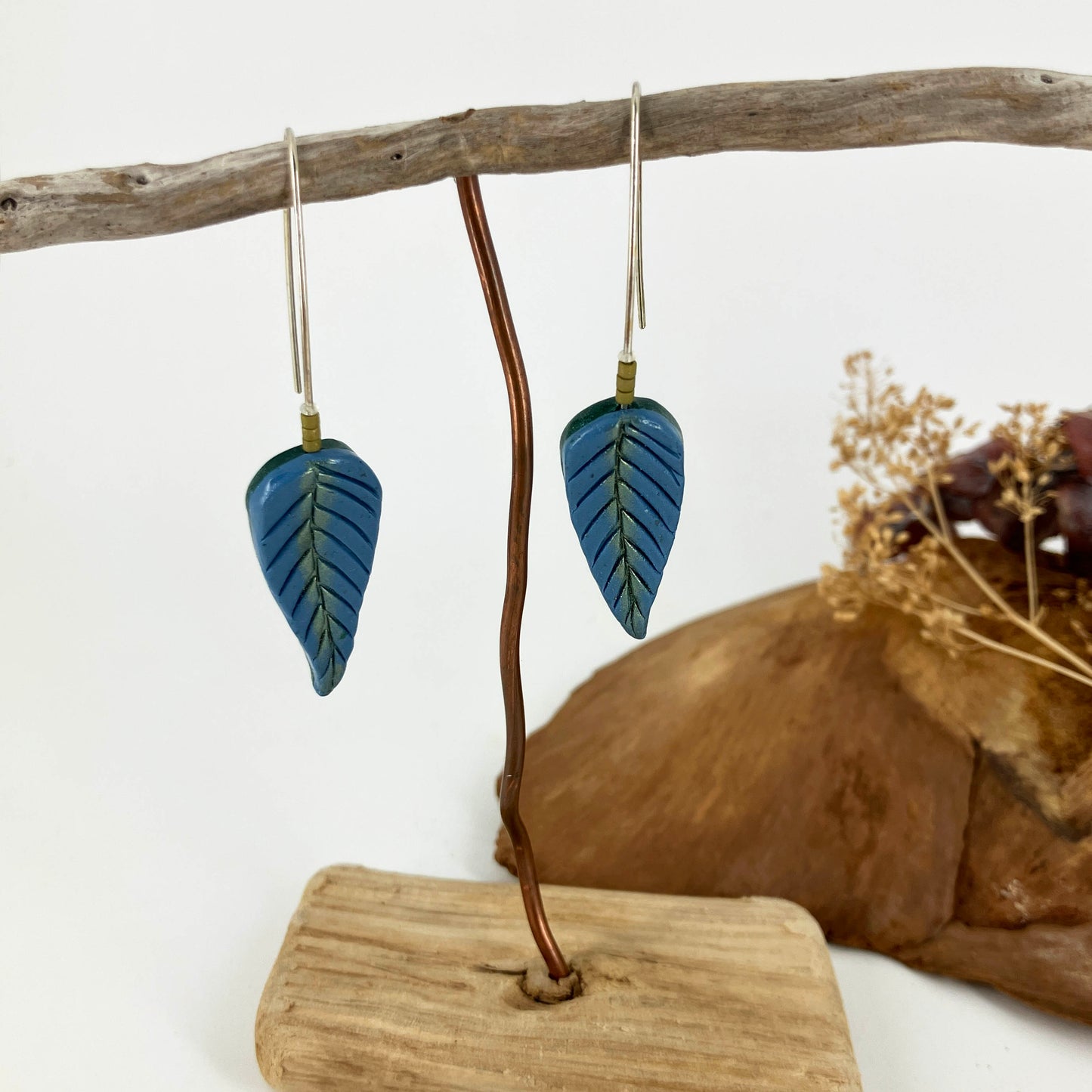 Stylish long hook drop earrings are formed handcrafted sterling silver wire and blue with green shimmer polymer clay. One of a kind by Linda Stiles Smith of NatureScapes Studio.