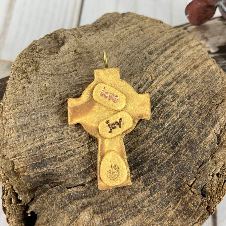 Abide in Me Small Celtic Cross Pendant made from Polymer Clay and Swarovski Crystals by Linda Stiles Smith of NatureScapes Studio. Back View of the emerald green on gold color. Christian Gifts For Women.