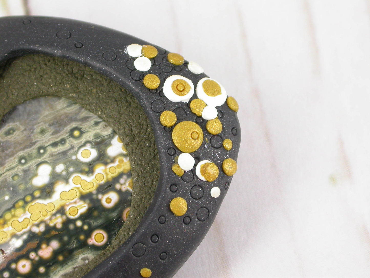 One-of-a-Kind Ocean Jasper Gemstone Brooch Handmade by Linda Stiles Smith of NatureScapes Studio. Gorgeous Ocean Green Colors, Gold Tone with White Dots and lightly sparkling Black Polymer Clay. Gift Ideas For Women. Gifts For Teachers. Wearable Art. Detailed Front View.