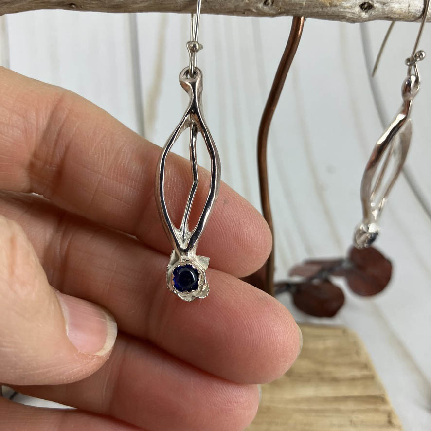Blueberry Branch Earrings Set. Handcrafted by Linda Stiles Smith of NatureScapes Studio in pure fine silver with blue sapphire cabochons accents. Front View Close Up Of Earrings. Collectible One Of A Kind Gift For Women.