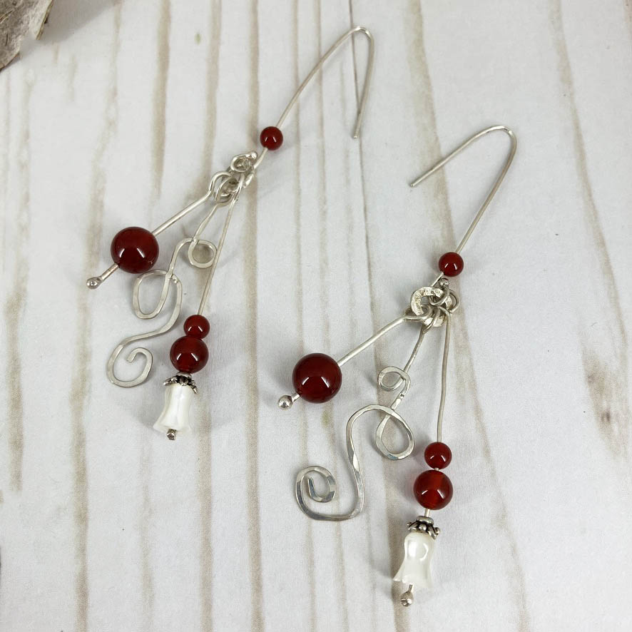 Ruby And Carnelian Wave Necklace And Earrings Set, Handmade By Linda Stiles Smith Of NatureScapes Studio. Red Carnalian Sterling Silver Earrings. Close-up view of the earrings. Unique gift for artistic women.