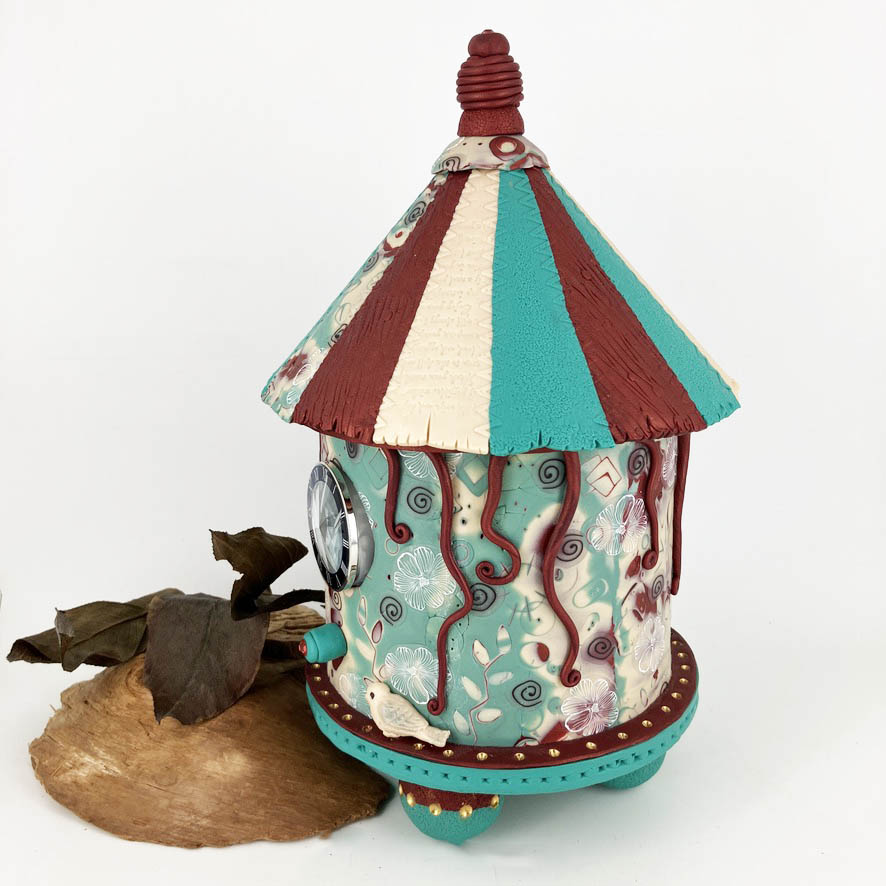 The Carousel Birdhouse dest clock is handcrafted by Linda Stiles Smith of NatureScapes Studio.