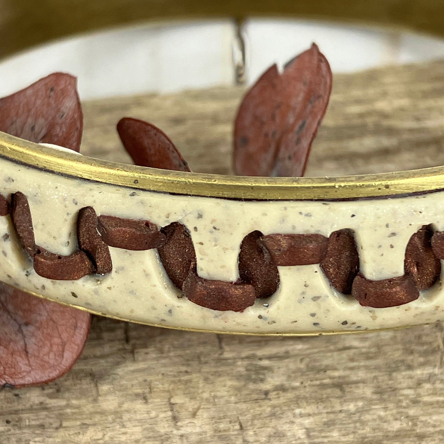 Detail of the polymer clay weaving on the faux leather look bangle bracelet by Linda Stiles Smith