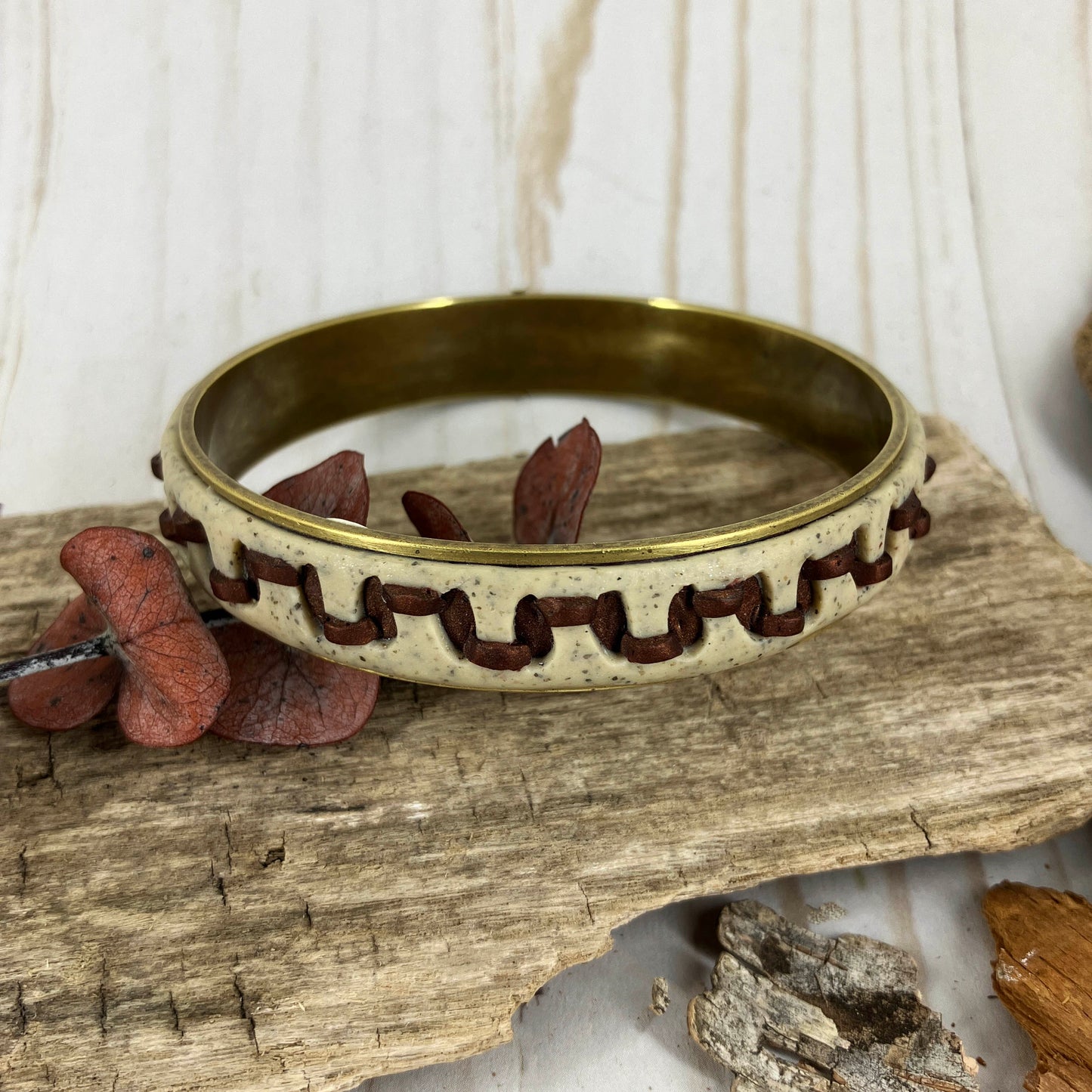 Narrow Bangle Bracelet has the look of faux stitching on leather for a casual feel that appears like the real thing. Designed by Linda Stiles Smith of NatureScapes Studio.