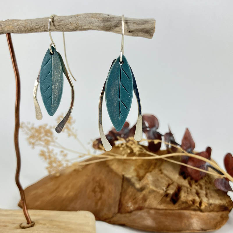 Blue earrings dusted with old and framed with hammered silver wires, these earrings are light as a summer breeze and play under your ears with any wardrobe choice.