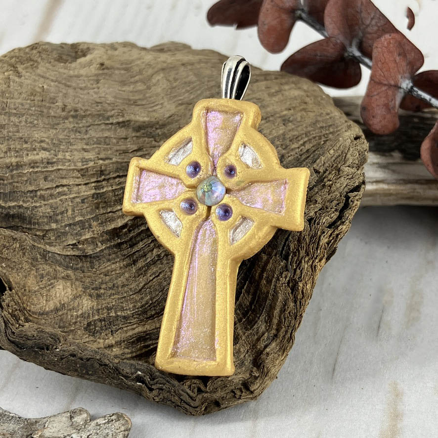 Abide in Me Medium Celtic Cross Pendant Handcrafted in Polymer Clay and genuine Swarovski Crystals by Linda Stiles Smith of NatureScapes Studio. Front View of the Gold clay color. Christian Gifts For Women.