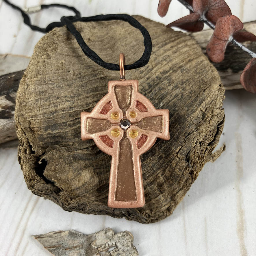 Abide in Me Medium Celtic Cross Pendant Handcrafted in Polymer Clay and genuine Swarovski Crystals by Linda Stiles Smith of NatureScapes Studio. Front View of the Bronze clay color. Christian Gifts For Women.