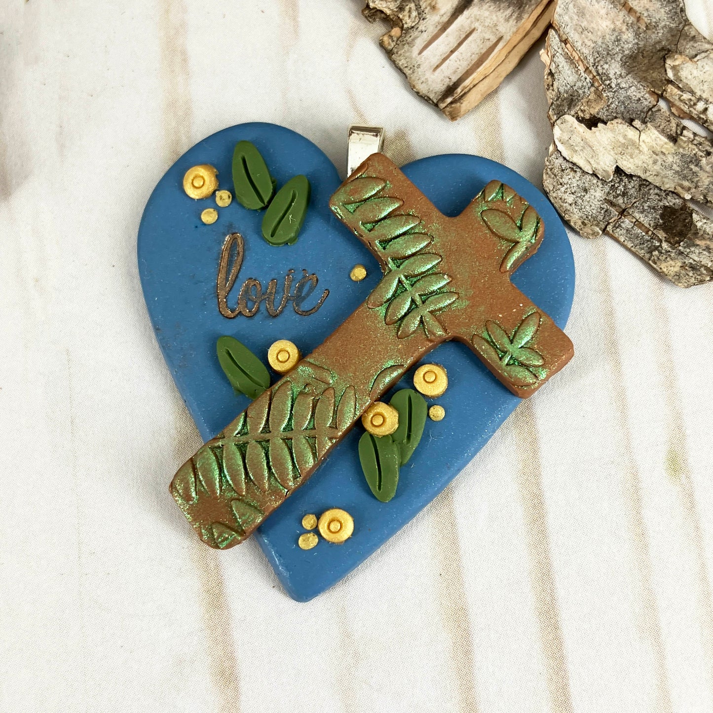 Heart of Faith "Old Wooden Cross" Pendant from the "Abide in Me" Series Showing the Blue version, front view. Handcrafted in Polymer Clay by Linda Stiles Smith of NatureScapes Studio. Gift for Christian Women.