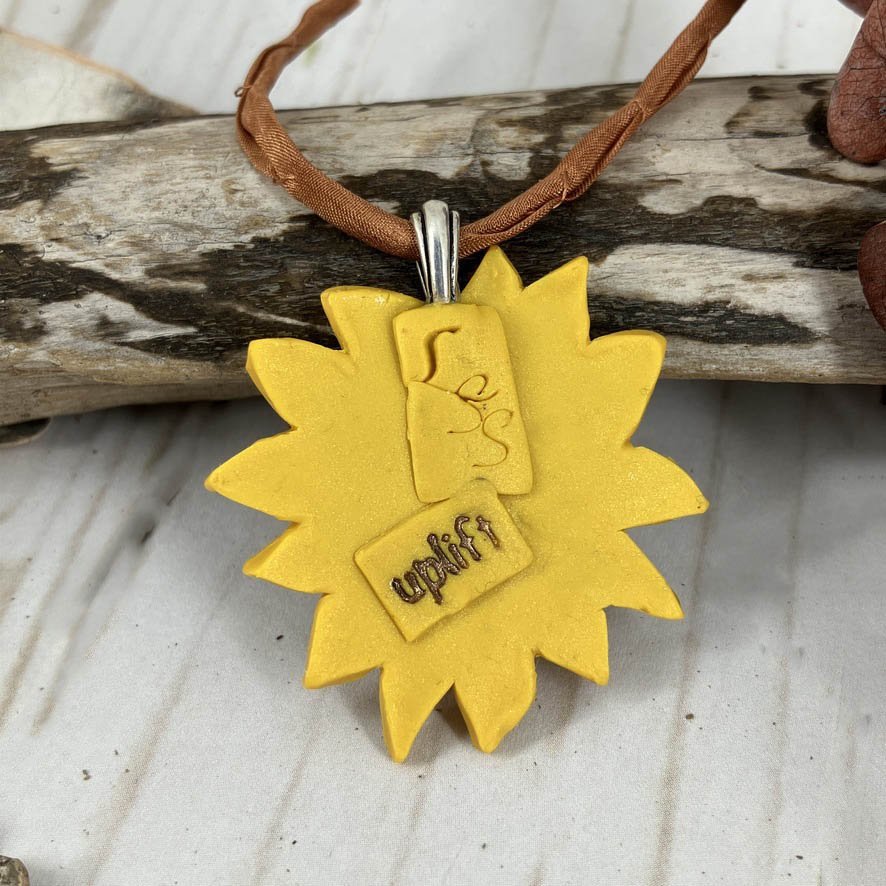 Sunflower pendant back with message tag "uplift" on sterling silver bail handcrafted by Linda Stiles Smtih of NatureScapes Studio. Stunning gift for women of all ages.