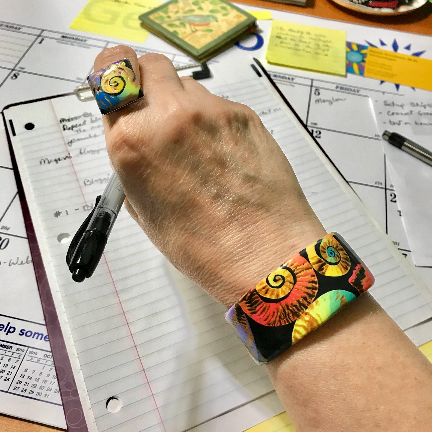 Symphony Of Color Swirls Cuff Bracelet Handmade With Polymer Clay By Linda Stiles Smith Of NatureScapes Studio. Nautilus Pattern Design. Multicolor Bracelet Gift For Women. Front View Worn By A Model.