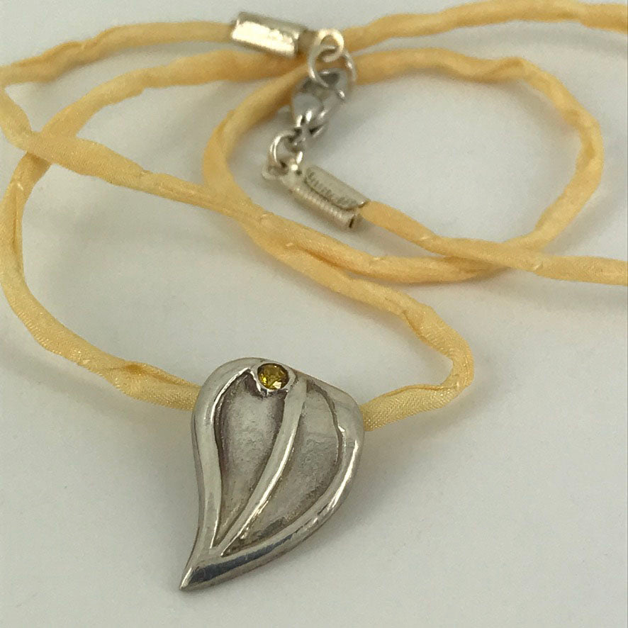 Gemstone Leaf Necklace on REAL SILK Cord handmade with genuine Fine Silver by Linda Stiles Smith of NatureScapes Studio. Front view. Gift ideas for women.
