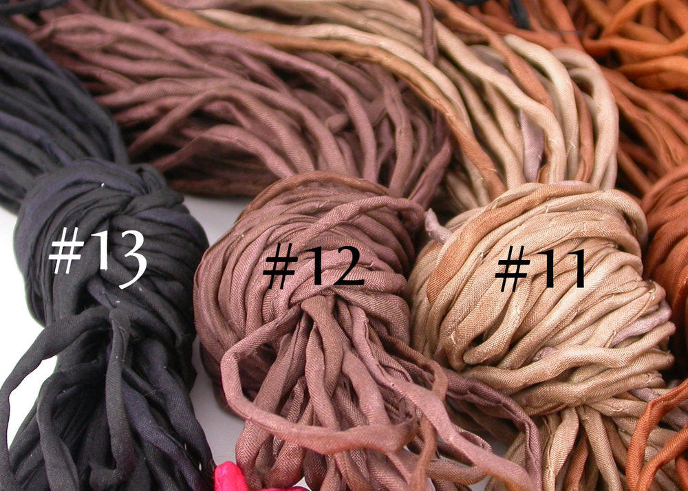 Close up of 2mm thick black brown and iced coffee silk cords by Linda Stiles Smith of NatureScapes Studio.
