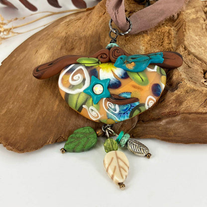 My Birdie Necklace on beaded silk cord