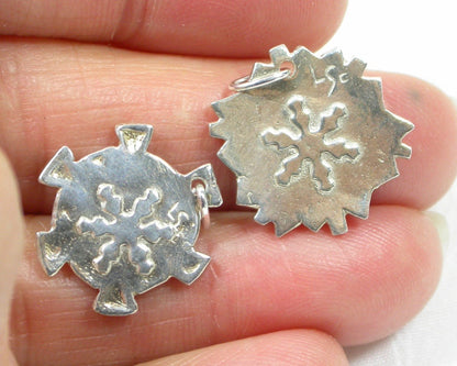 Snowflakes falling caught on a pendant with a fine silk necklace