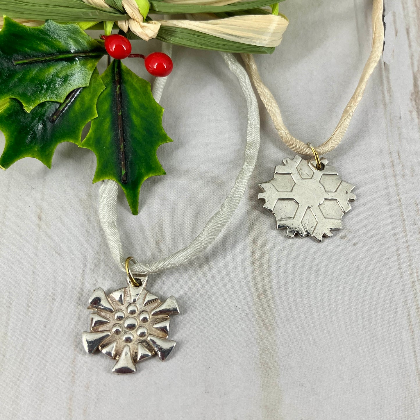 Snowflakes falling caught on a pendant with a fine silk necklace