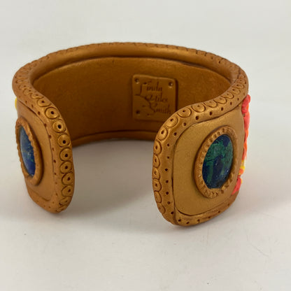 Colorful leaf pattern with lapis gemstone makes a versatile bracelet