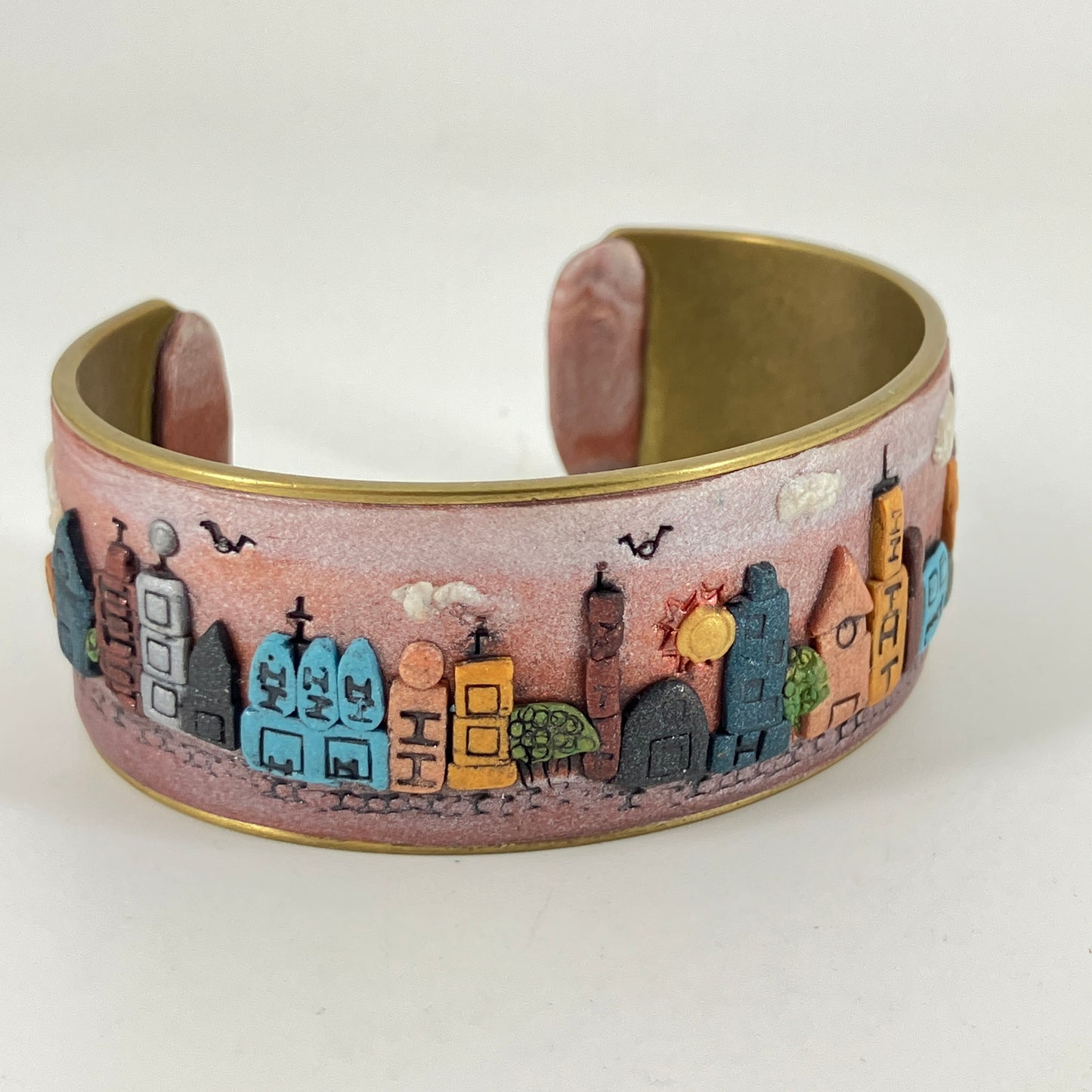 Wearable city landscapes in clay on a cuff bracelt