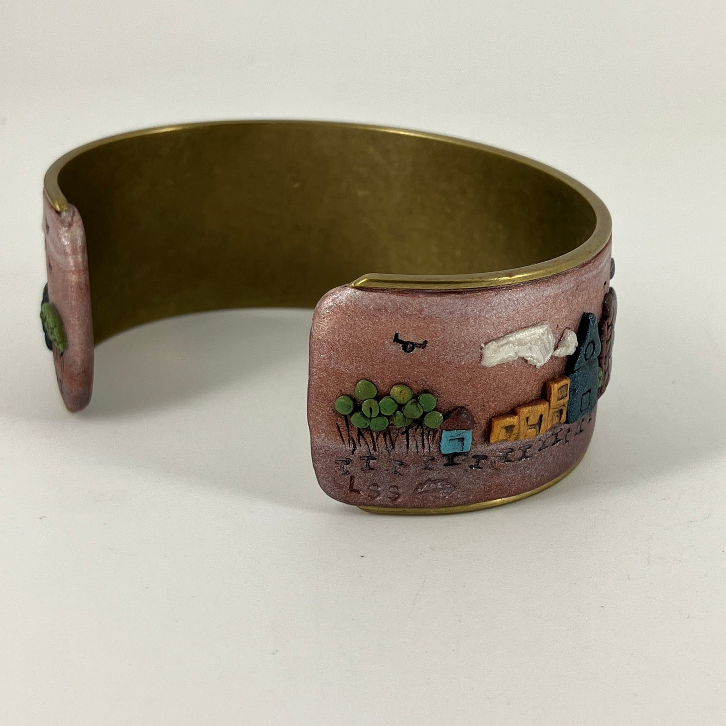 Wearable city landscapes in clay on a cuff bracelt