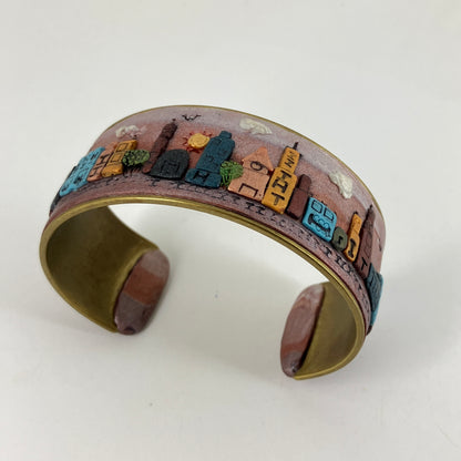 Wearable city landscapes in clay on a cuff bracelt