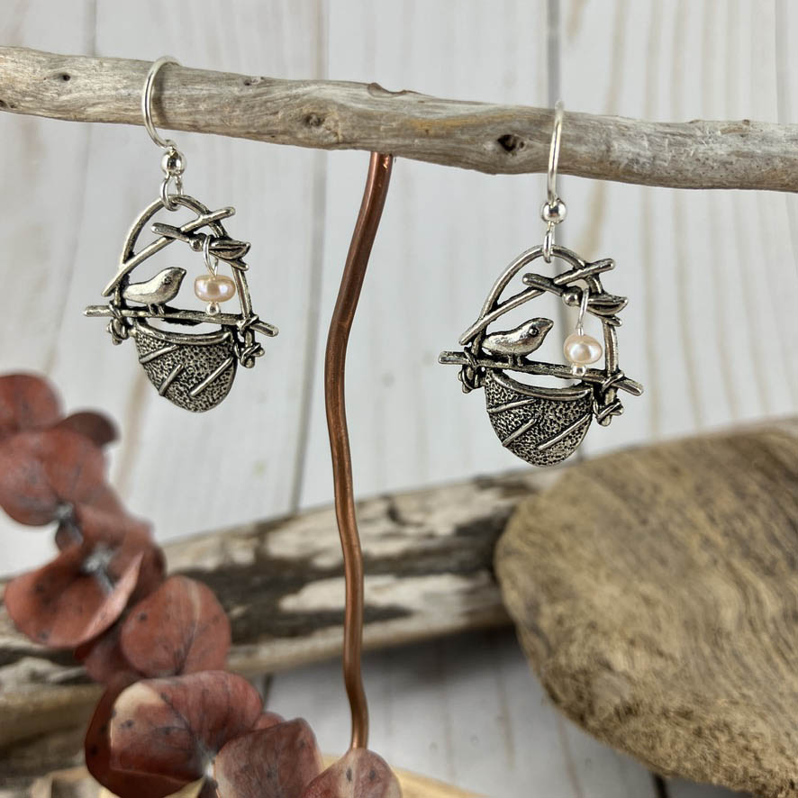 Little Tweets birdnest charm adorned with a tiny pearl egg make darling earrings. Crafted by Linda Stiles Smith