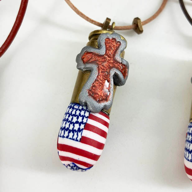 American Flag Cross Pendant Necklace - The Full Armor of God in size Small. Handmade with Polymer Clay and spent brass by Linda Stiles Smith of NatureScapes Studio. Front view. Gifts for Military Patriotic Men and Women.