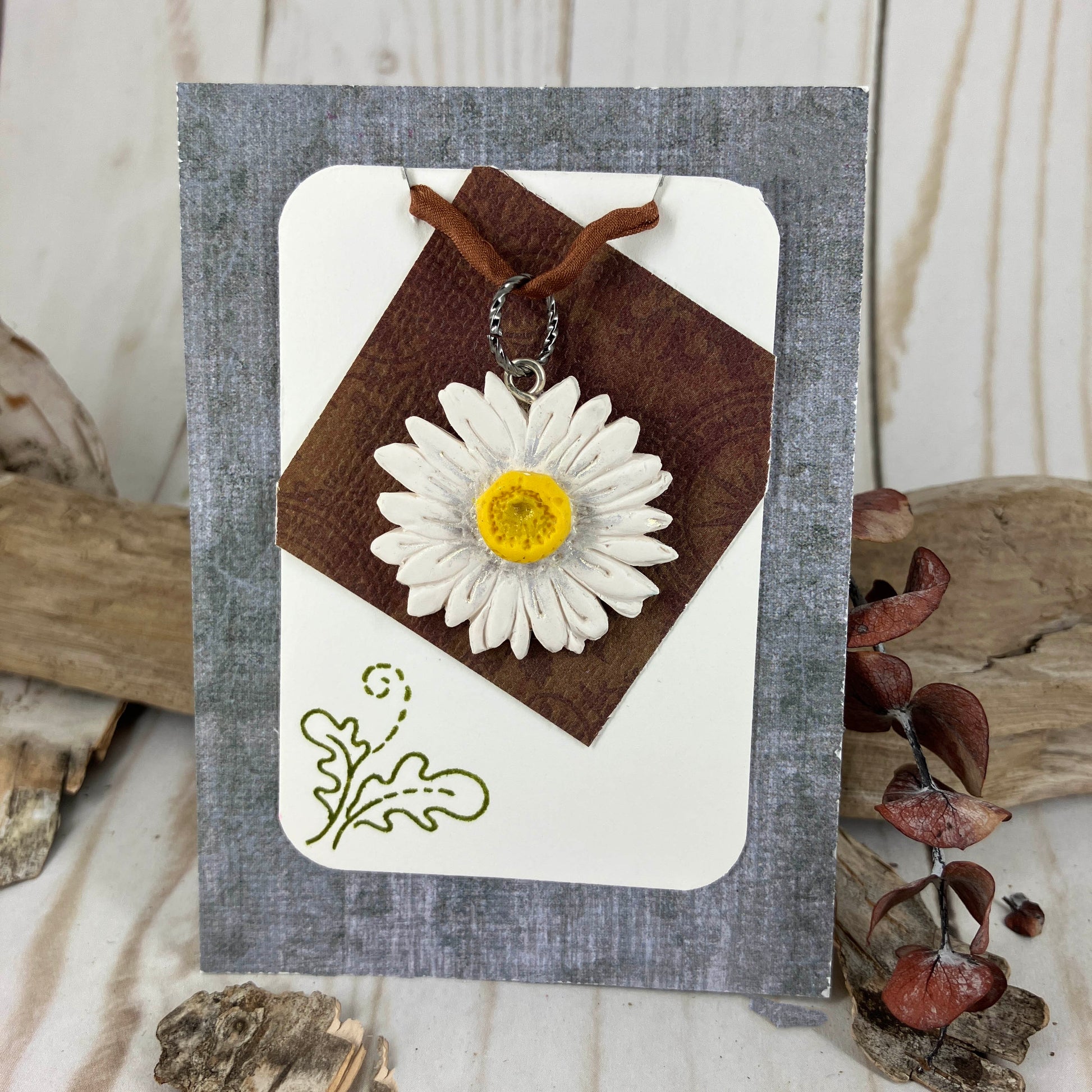 Happy daisy pendant handcrafted in polymer clay with shimmering accents for a happy spring. Crated by Linda Stiles Smith of NatureScapes Studio