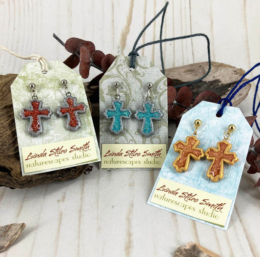 Inner Glow Cross Earrings Warm Hues Collection Handmade with polymer clay by Linda Stiles Smith of NatureScapes Studio. Front view of the colors: Red, Turquoise and Copper-Gold. Gift ideas for Christian Women.