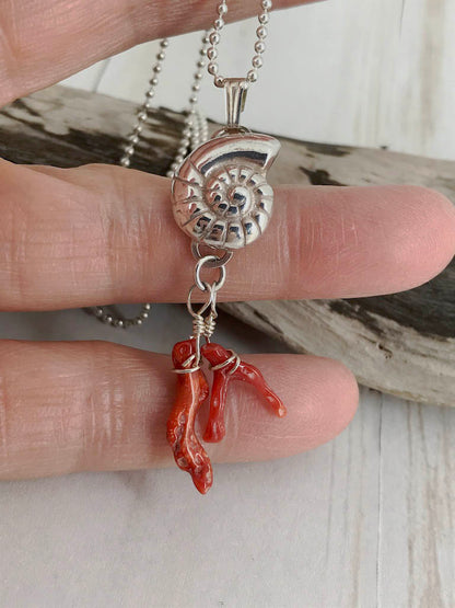 Fine silver nautilus with branch coral - a picture of the sea