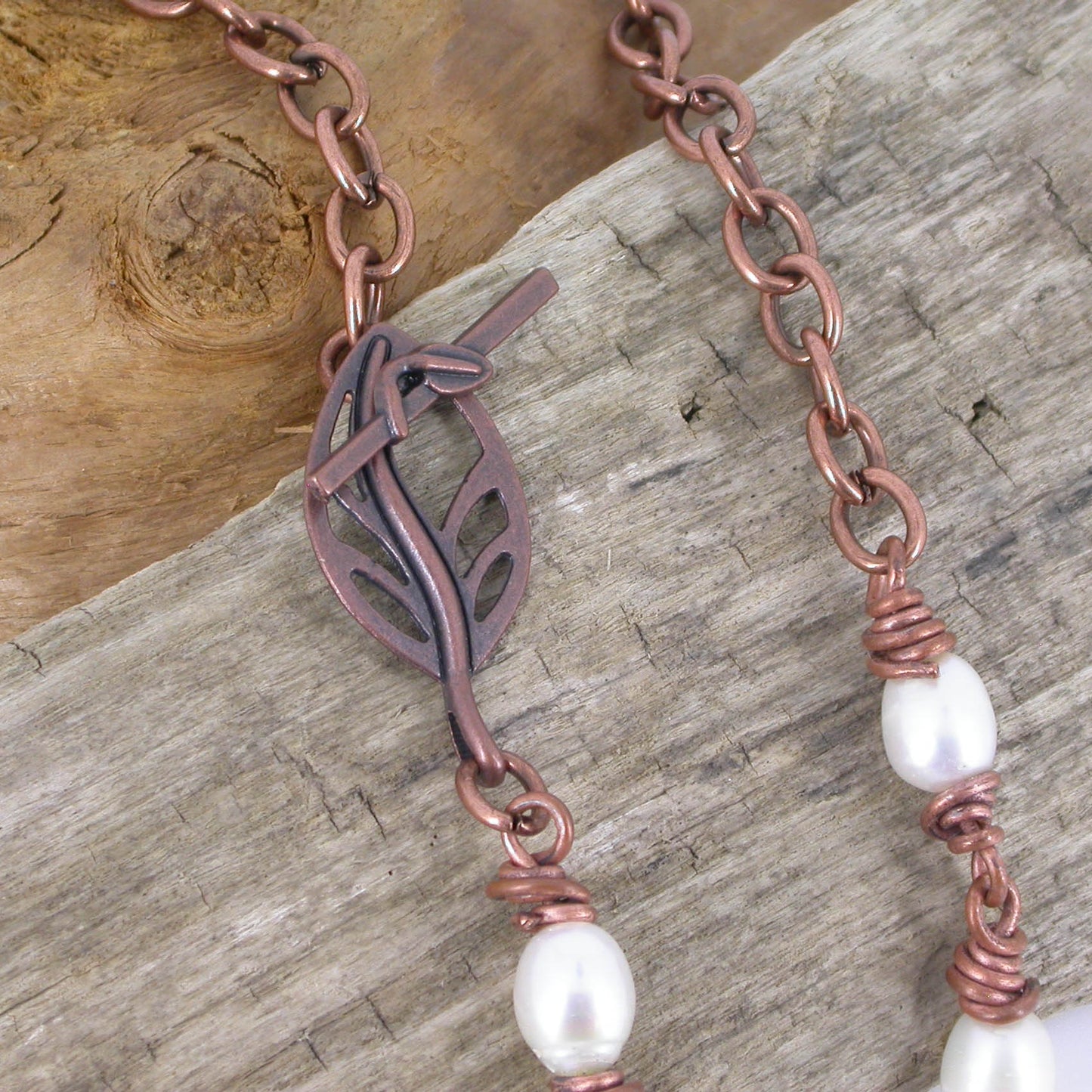 Solid Copper and Freshwater Pearl Necklace by Linda Styles Smith of NatureScapes Studio. Made with Copper Links and 7 Freshwater White Pearls. Leaf Toggle Clasp Detailed View.