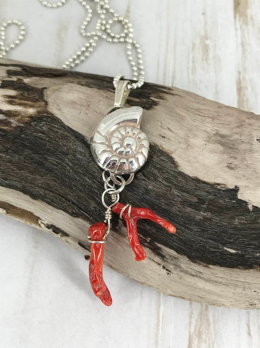 Fine silver nautilus with branch coral - a picture of the sea