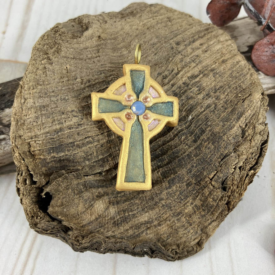 Abide in Me Small Celtic Cross Pendant made from Polymer Clay and Swarovski Crystals by Linda Stiles Smith of NatureScapes Studio. Front View of the Emerald green color on gold. Christian Gifts For Women.