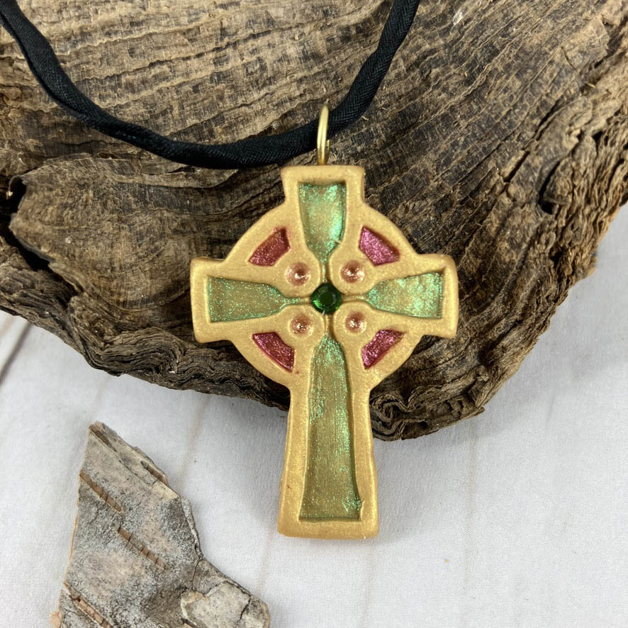 Abide in Me Small Celtic Cross Pendant made from Polymer Clay and Swarovski Crystals by Linda Stiles Smith of NatureScapes Studio. Front View of the multicolor bright green, with red, on gold color. Christian Gifts For Women.