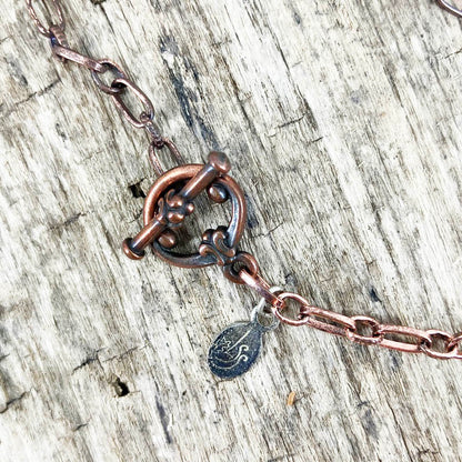 Copper toggle clasp and chain on Symbol of Love pendant designed by Linda Stiles Smith of NatureScapes  Studio.