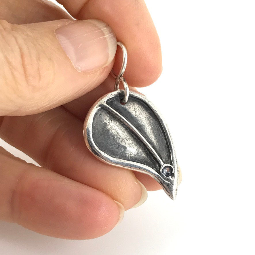 Fine Silver Birthday Leaf Shaped Pendant with birthday month colored stone. Gift for women handmade by Linda Stiles Smith of NatureScapes Studio. Front view, featuring a Faux Amethyst Color Cubic Zirconia for the month of February.