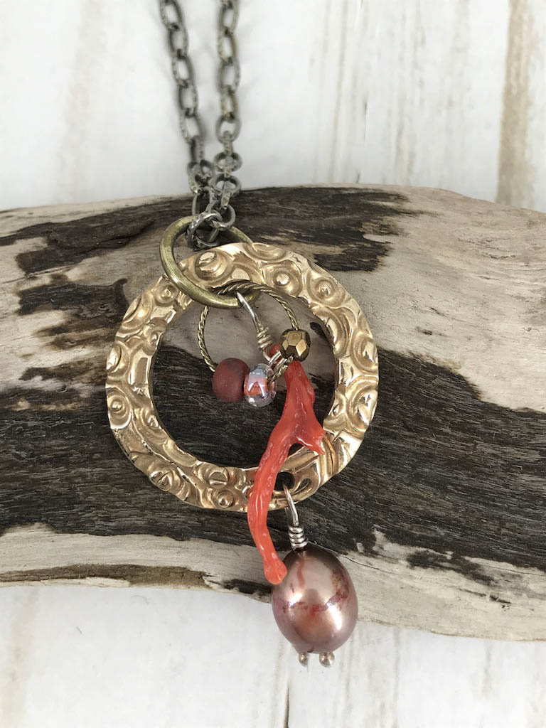 Handmade gift for women made of bronze metal clay and paired with a beautiful large pearl, coordinated beads and a branch coral piece, on a steel necklace chain. Handmade by Linda Stiles Smith of NatureScapes Studio. Front View.