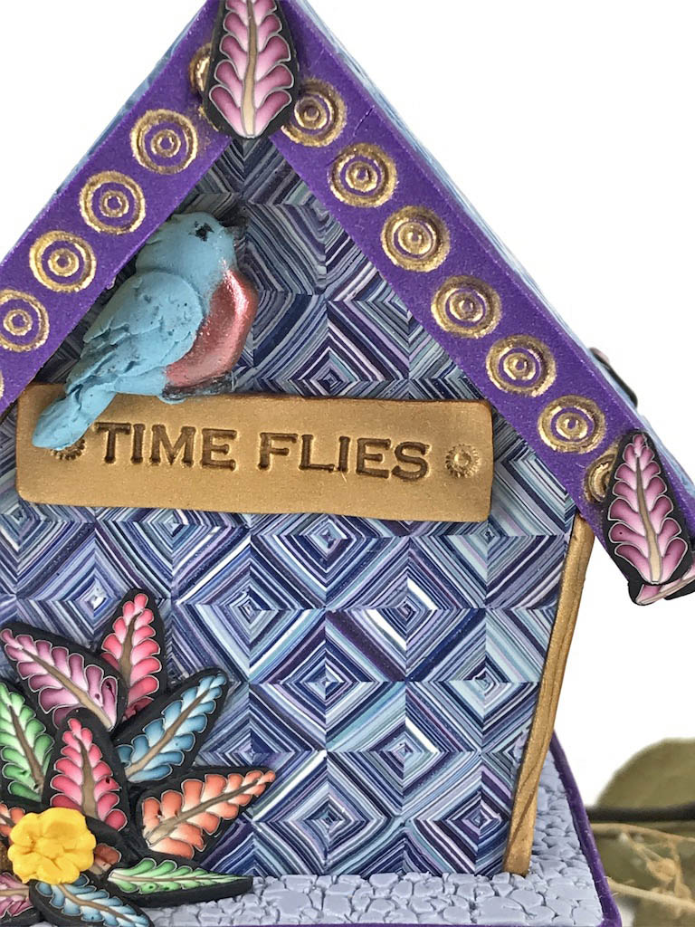 Time Flies Blue and Purple Bird House Desk Clock handmade with Polymer Clay by Linda Stiles Smith of NatureScapes Studio. Back Blue Bird Details view. Gift ideas for women.