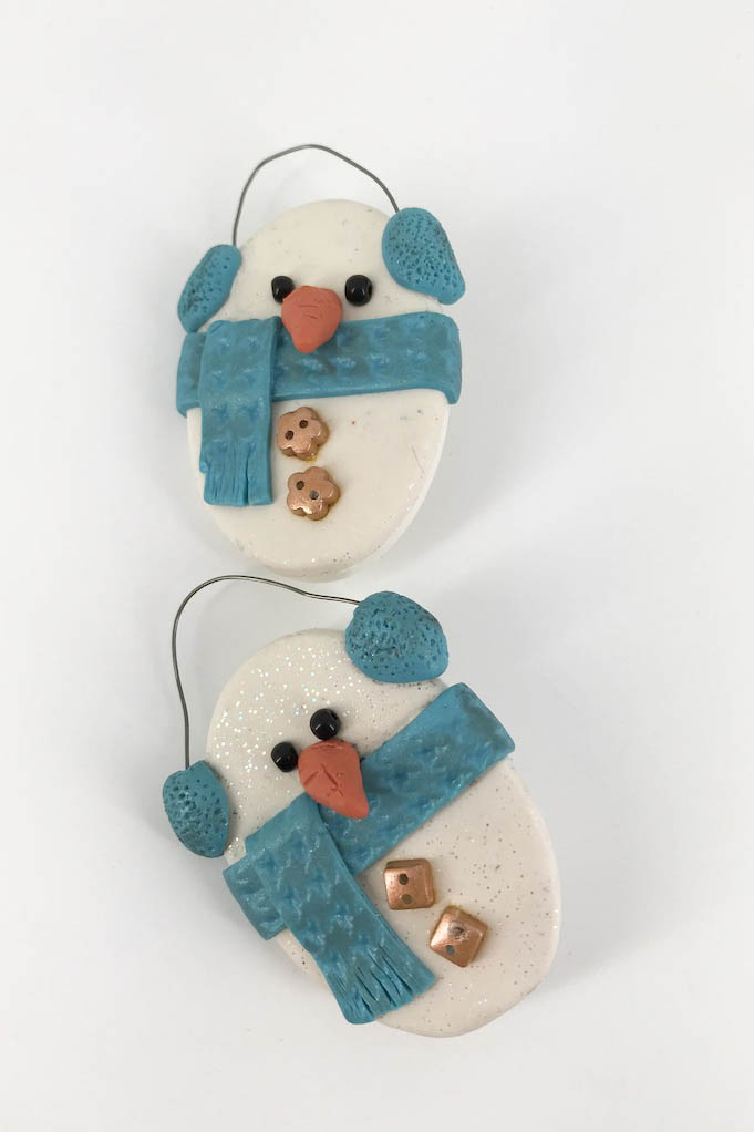 Winter Snowman Lapel Pin Brooch. One Of A Kind Gift Idea and Stocking Stuffer. Handmade with Polymer Clay by Linda Stiles Smith of NatureScapes Studio. Front view. Turquoise Blue version. Gift ideas for women.