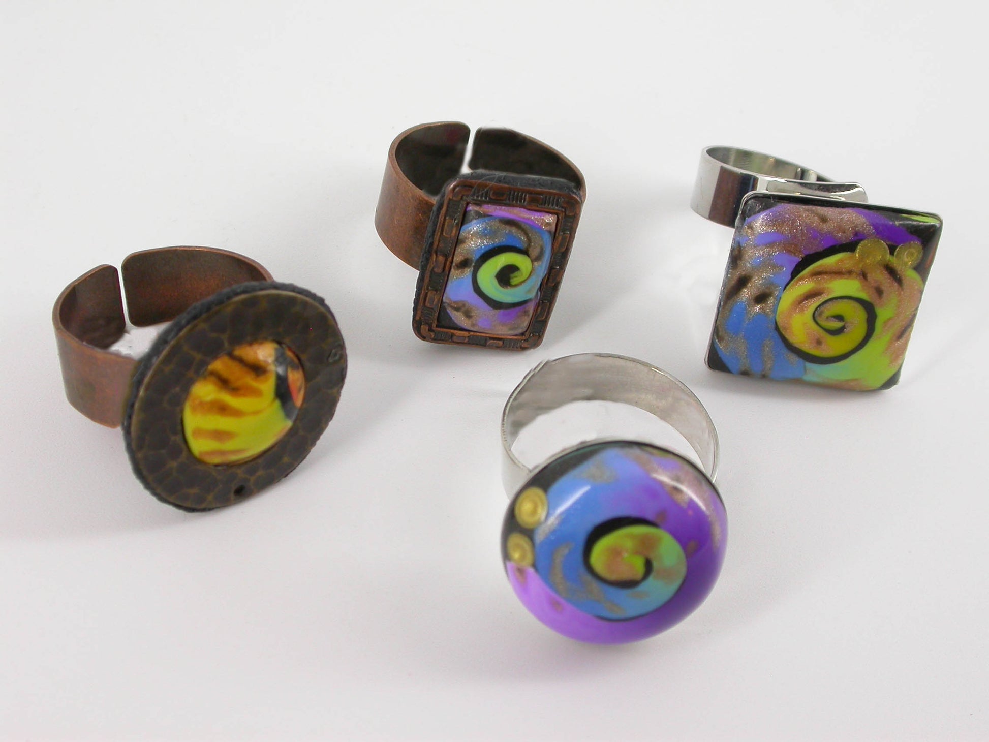 Swirls of Color Adjustable Rings handmade with Polymer Clay by Linda Stiles Smith of NatureScapes Studio. Assortment of Designs view. Gift ideas for women.