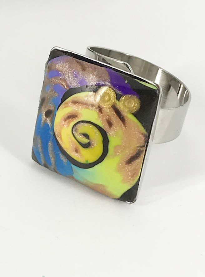 Swirls of Color Adjustable Rings handmade with Polymer Clay by Linda Stiles Smith of NatureScapes Studio. Yellow Blue Black Purple Swirl Silver Ring view. Gift ideas for women.